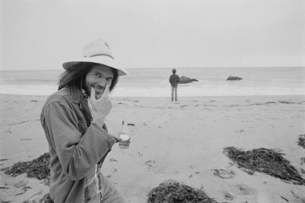 ca. 1975, Malibu, California, USA --- Musician Neil Young at the Beach --- Image by © Henry Diltz/CORBIS